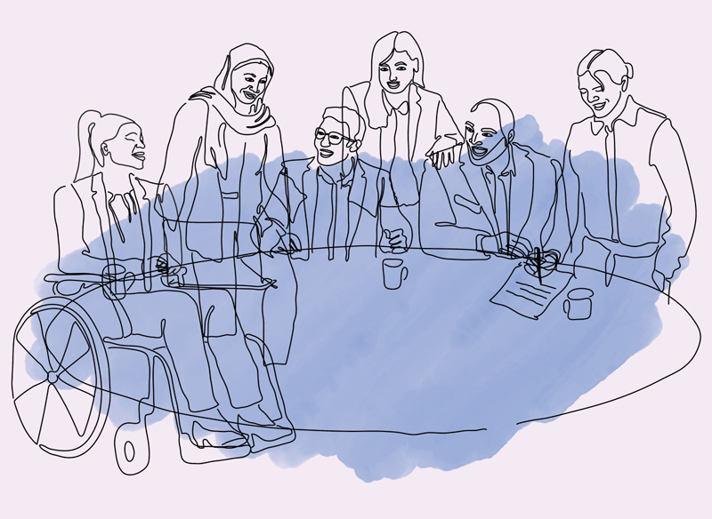 Blandad grupp människor runt ett bord.