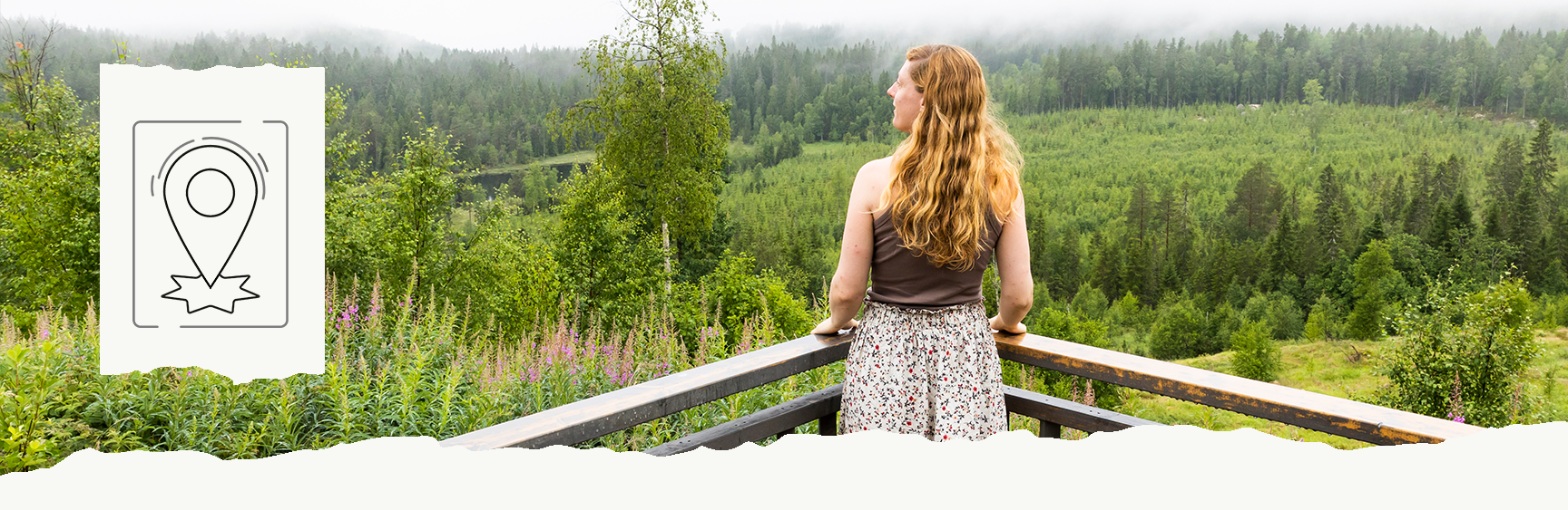 Woman standing on a deck looking at the forrest