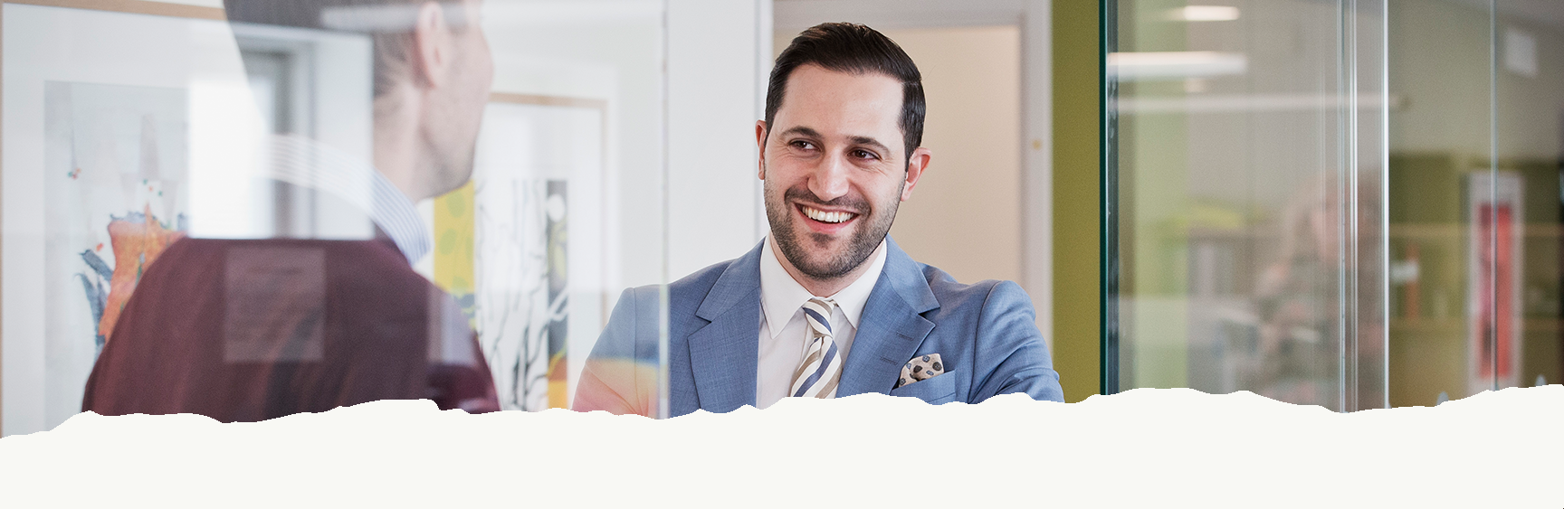 Two people speaking an laughing