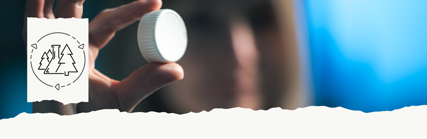 Woman holding bottle cap