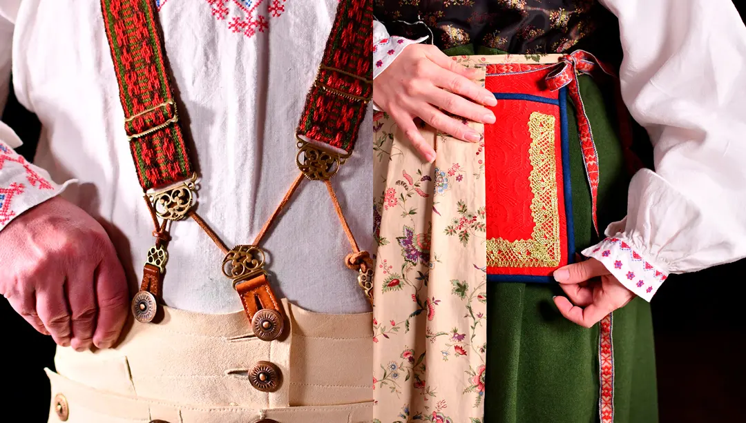 Detalj från manlig och kvinnlig folkdräkt.